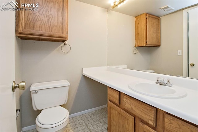124 W Rockrimmon Blvd Unit 103, Colorado Springs, CO 80919 - half bath featuring toilet, baseboards, and vanity