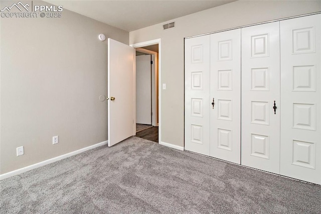 124 W Rockrimmon Blvd Unit 103, Colorado Springs, CO 80919 - unfurnished bedroom with carpet flooring, a closet, and baseboards