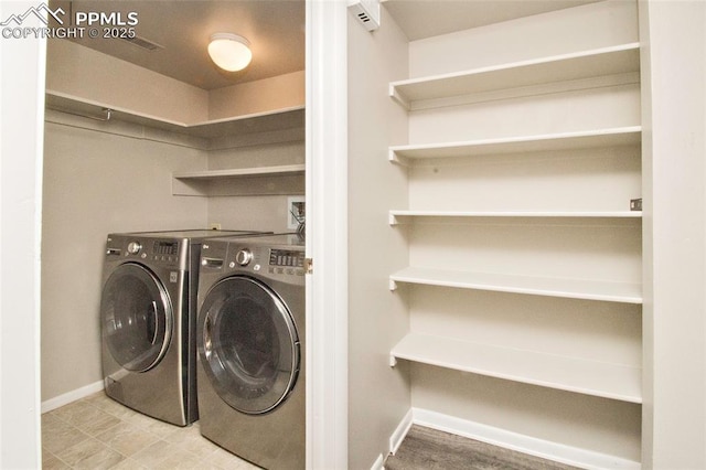 124 W Rockrimmon Blvd Unit 103, Colorado Springs, CO 80919 - laundry area with washer and dryer and baseboards