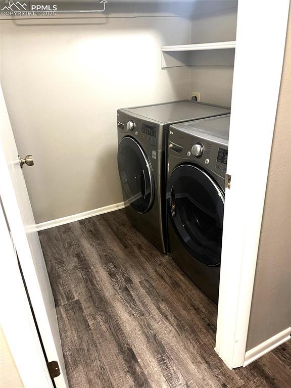 124 W Rockrimmon Blvd Unit 103, Colorado Springs, CO 80919 - washroom featuring separate washer and dryer, wood finished floors, and baseboards
