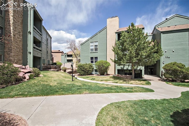 124 W Rockrimmon Blvd Unit 103, Colorado Springs, CO 80919 - view of home's community featuring a lawn and a residential view