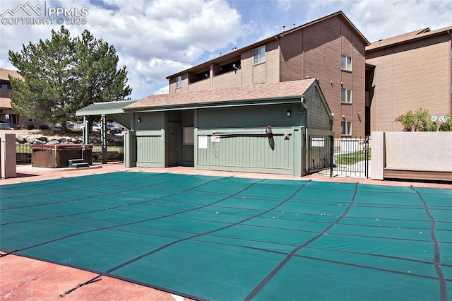 124 W Rockrimmon Blvd Unit 103, Colorado Springs, CO 80919 - view of pool with a hot tub and fence