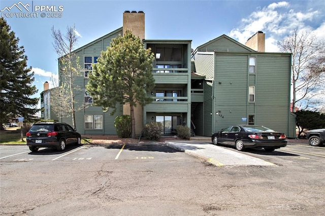 124 W Rockrimmon Blvd Unit 103, Colorado Springs, CO 80919 - view of building exterior with uncovered parking
