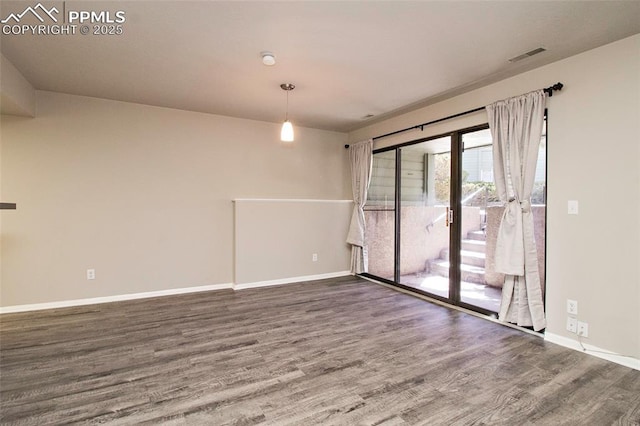 124 W Rockrimmon Blvd Unit 103, Colorado Springs, CO 80919 - unfurnished room featuring wood finished floors and baseboards