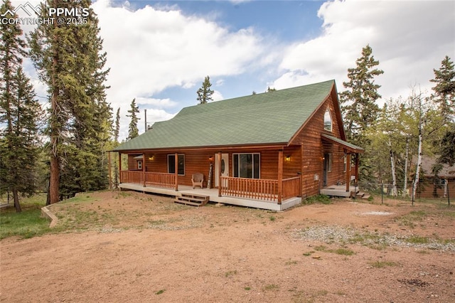 16 Echo Cir, Florissant, CO 80816 - log-style house with driveway and roof with shingles