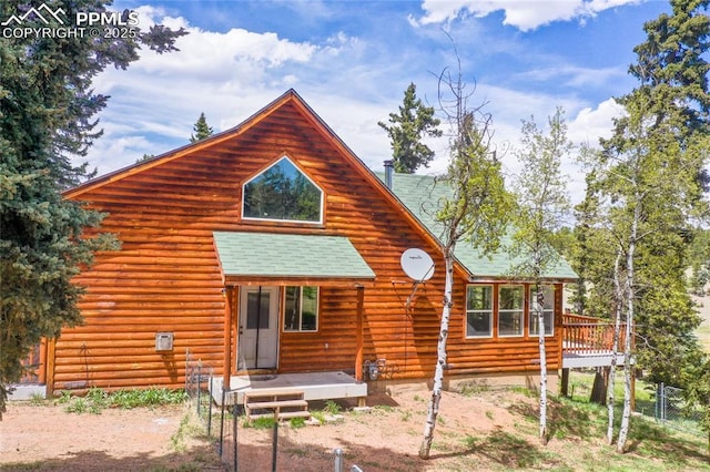 16 Echo Cir, Florissant, CO 80816 - rear view of house with roof with shingles, log exterior, and a deck