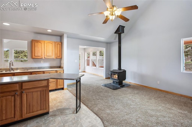 16 Echo Cir, Florissant, CO 80816 - kitchen featuring a sink, healthy amount of natural light, light colored carpet, recessed lighting, and high vaulted ceiling