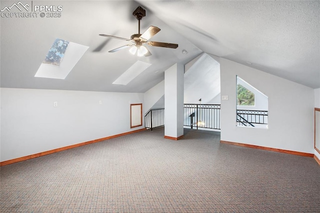 16 Echo Cir, Florissant, CO 80816 - bonus room featuring a skylight, a ceiling fan, carpet flooring, lofted ceiling, and baseboards