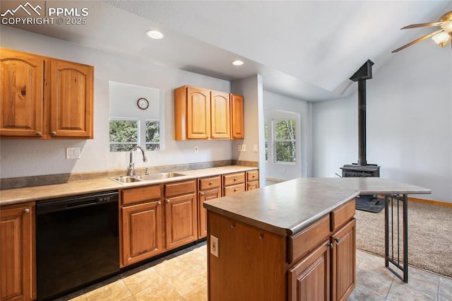 16 Echo Cir, Florissant, CO 80816 - kitchen featuring dishwasher, a sink, a ceiling fan, a wood stove, and recessed lighting