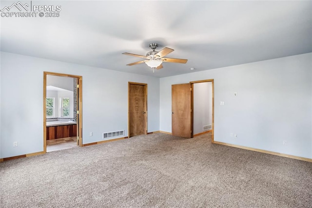 16 Echo Cir, Florissant, CO 80816 - unfurnished bedroom with light colored carpet, baseboards, ensuite bath, and ceiling fan