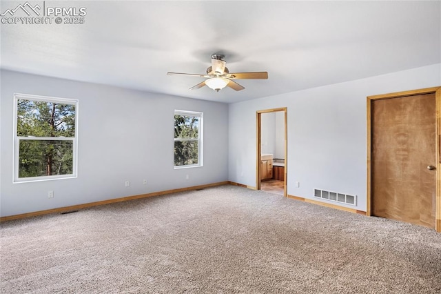 16 Echo Cir, Florissant, CO 80816 - unfurnished bedroom featuring carpet floors, baseboards, connected bathroom, and a ceiling fan