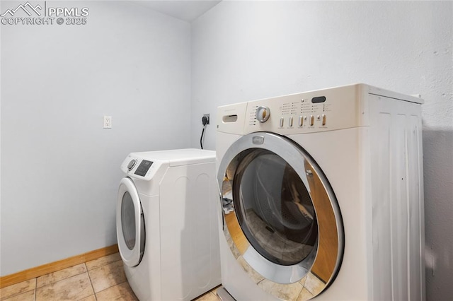 16 Echo Cir, Florissant, CO 80816 - washroom featuring washing machine and dryer and light tile patterned floors