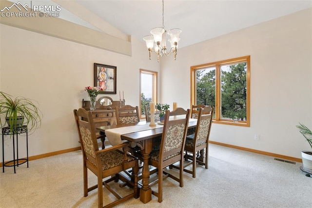 17575 Minglewood Trl, Monument, CO 80132 - dining room with light carpet, a chandelier, baseboards, and lofted ceiling