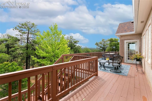 17575 Minglewood Trl, Monument, CO 80132 - wooden terrace with outdoor dining space