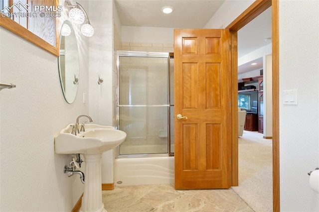 17575 Minglewood Trl, Monument, CO 80132 - bathroom featuring bath / shower combo with glass door, recessed lighting, and a sink
