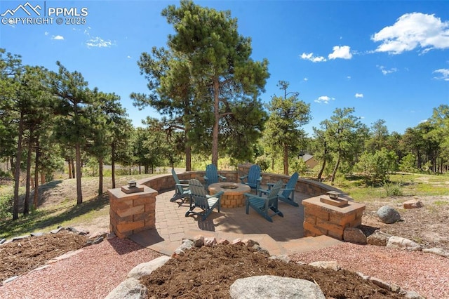 17575 Minglewood Trl, Monument, CO 80132 - view of patio / terrace featuring an outdoor fire pit