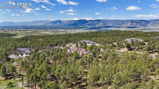 17575 Minglewood Trl, Monument, CO 80132 - drone / aerial view of mountains and a forest