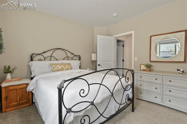 bedroom featuring light carpet