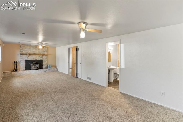 514 Dexter St, Colorado Springs, CO 80911 - unfurnished living room with ceiling fan, carpet floors, a fireplace, and baseboards