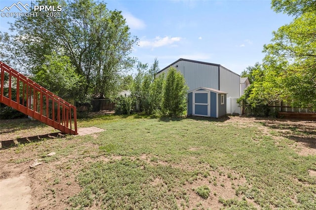 514 Dexter St, Colorado Springs, CO 80911 - view of yard featuring a shed and an outbuilding