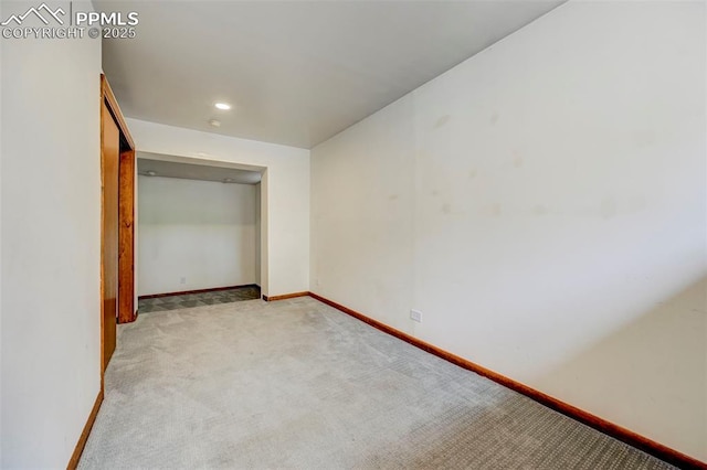 458 S Downing St, Denver, CO 80209 - unfurnished bedroom featuring light carpet and baseboards