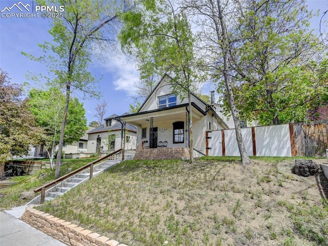 458 S Downing St, Denver, CO 80209 - view of front of property featuring a porch, fence, and stairway