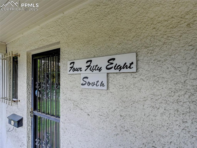 458 S Downing St, Denver, CO 80209 - doorway to property featuring stucco siding