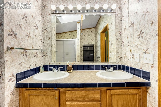 20625 El Nino Pt, Fountain, CO 80817 - bathroom with wallpapered walls, double vanity, and a stall shower