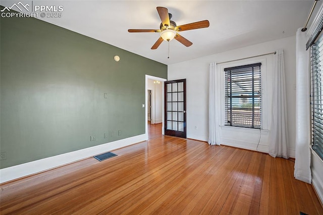 806 E Platte Ave, Colorado Springs, CO 80903 - spare room featuring a ceiling fan, light wood-type flooring, and baseboards
