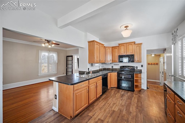 806 E Platte Ave, Colorado Springs, CO 80903 - kitchen featuring black appliances, dark countertops, dark wood finished floors, a sink, and ceiling fan