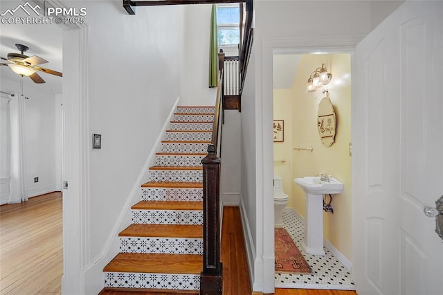 806 E Platte Ave, Colorado Springs, CO 80903 - stairway with ceiling fan, baseboards, and wood finished floors