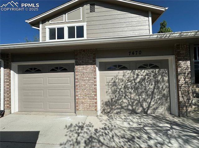 garage featuring driveway
