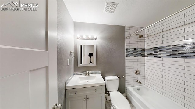 1636 Shenandoah Dr, Colorado Springs, CO 80910 - full bath with a textured wall, toilet,  shower combination, and vanity