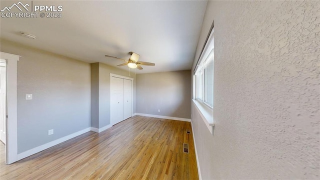 1636 Shenandoah Dr, Colorado Springs, CO 80910 - unfurnished bedroom featuring light wood-type flooring, baseboards, a closet, and ceiling fan