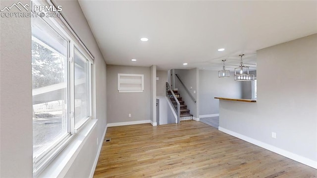 1636 Shenandoah Dr, Colorado Springs, CO 80910 - empty room with recessed lighting, light wood-style flooring, baseboards, and stairs