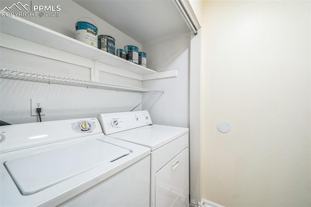 washroom featuring washer and clothes dryer