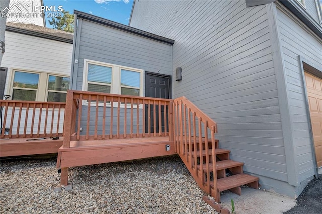 doorway to property with a deck