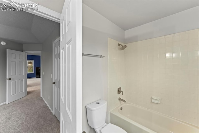 full bathroom with lofted ceiling, toilet, shower / washtub combination, and baseboards