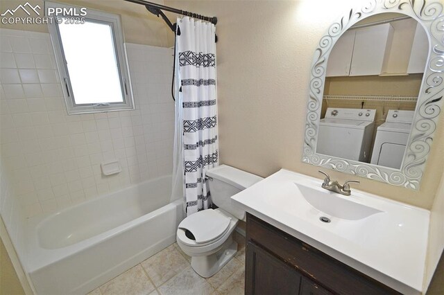 632 Rye Ridge Rd, Fountain, CO 80817 - full bath featuring washing machine and clothes dryer, toilet, shower / bath combination with curtain, vanity, and tile patterned flooring