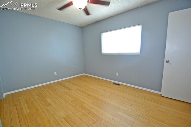 632 Rye Ridge Rd, Fountain, CO 80817 - unfurnished room with a ceiling fan, wood finished floors, baseboards, and a textured ceiling