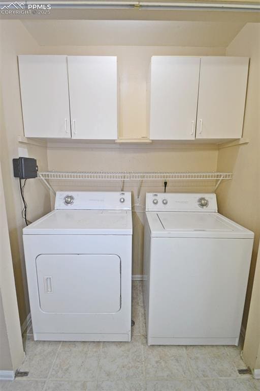 632 Rye Ridge Rd, Fountain, CO 80817 - laundry area featuring washing machine and dryer and cabinet space