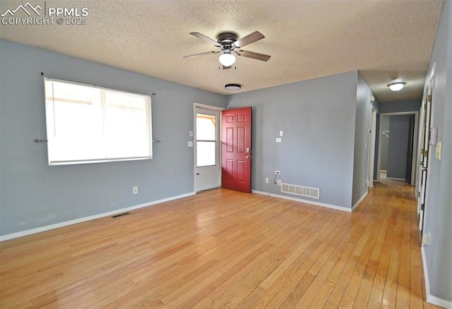 632 Rye Ridge Rd, Fountain, CO 80817 - spare room with a textured ceiling, ceiling fan, light wood-style flooring, and baseboards