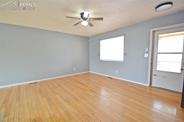 632 Rye Ridge Rd, Fountain, CO 80817 - unfurnished room featuring ceiling fan, a textured ceiling, hardwood / wood-style flooring, and baseboards