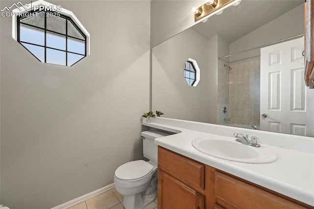full bath featuring toilet, vanity, tile patterned floors, and baseboards