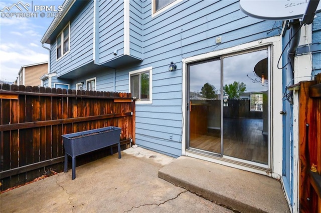 view of patio / terrace featuring fence