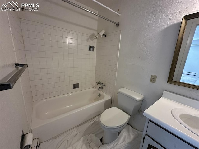 1769 Woodmoor Dr, Monument, CO 80132 - full bathroom featuring toilet, shower / tub combination, vanity, a textured wall, and marble finish floors