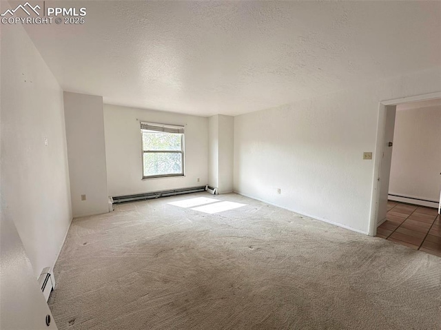 1769 Woodmoor Dr, Monument, CO 80132 - carpeted spare room featuring a baseboard radiator, a textured ceiling, and a baseboard heating unit