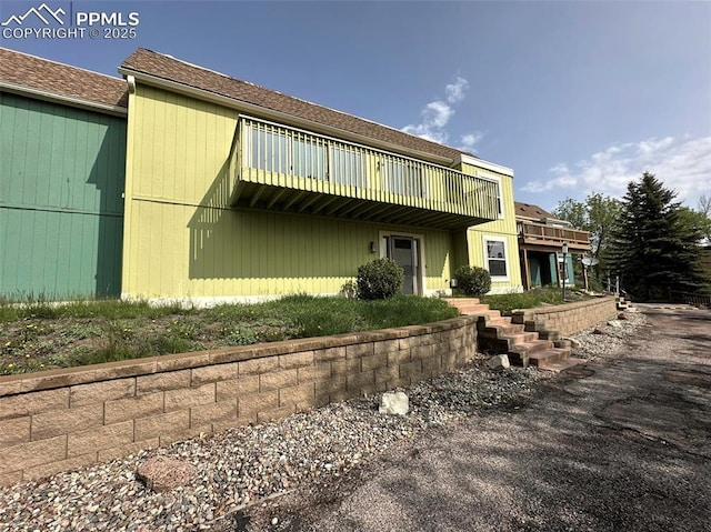 1769 Woodmoor Dr, Monument, CO 80132 - rear view of property with a deck