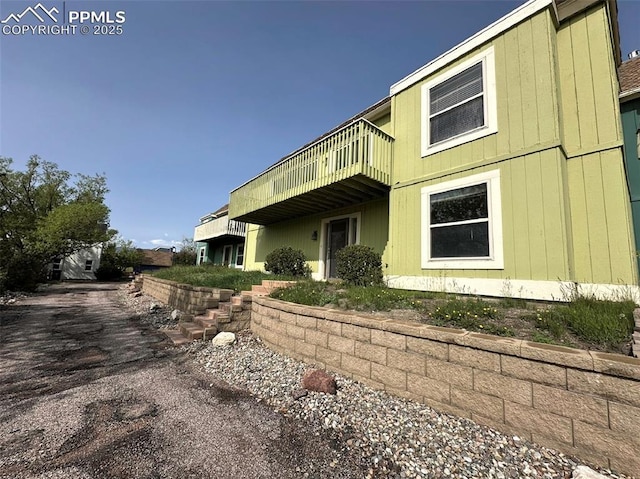1769 Woodmoor Dr, Monument, CO 80132 - view of side of home with a balcony