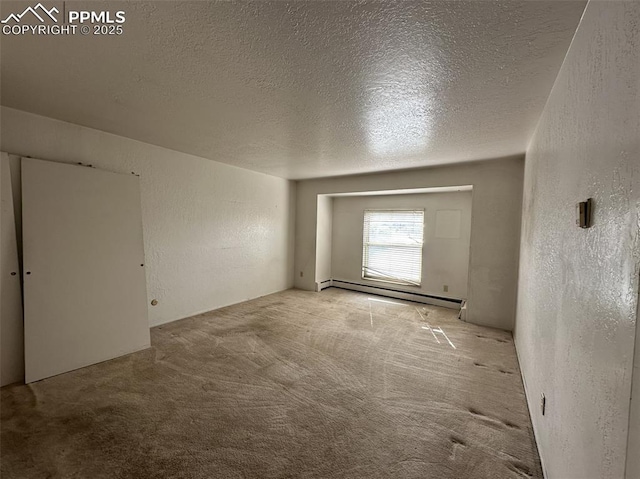 1769 Woodmoor Dr, Monument, CO 80132 - unfurnished room featuring baseboard heating, a textured ceiling, carpet floors, and a textured wall
